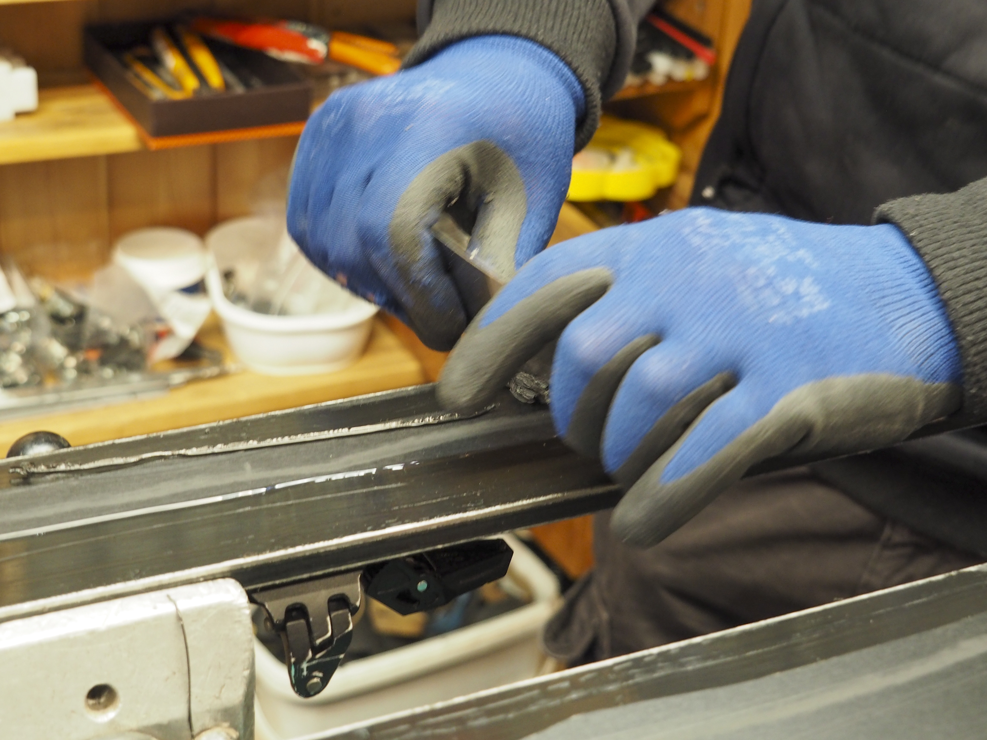 Technician using a scraper